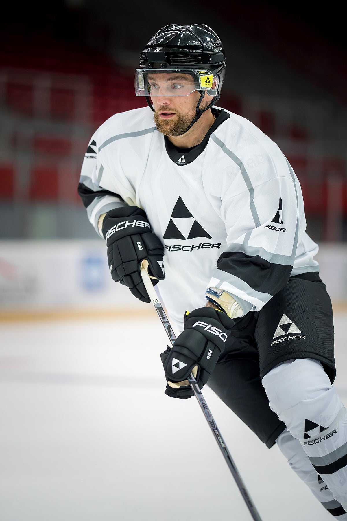 CT850 Pro Hockey Gloves - Junior action lifestyle photo 1